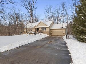 photo 1 of 56210 Eleven Mile Rd, New Hudson, MI 48165